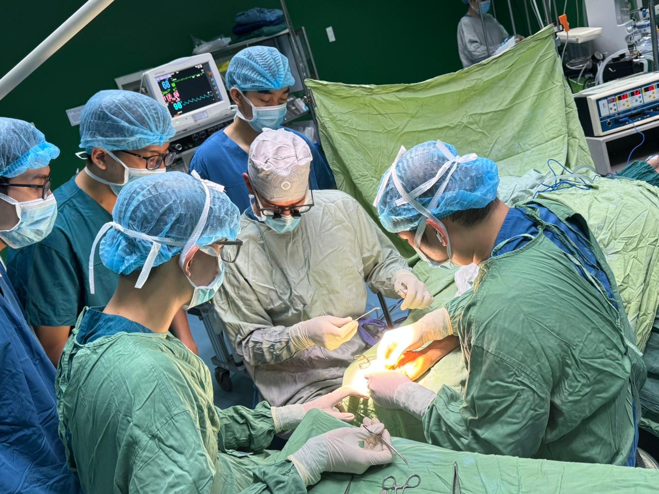 Surgical team performing hand surgery in Da Nang, Vietnam