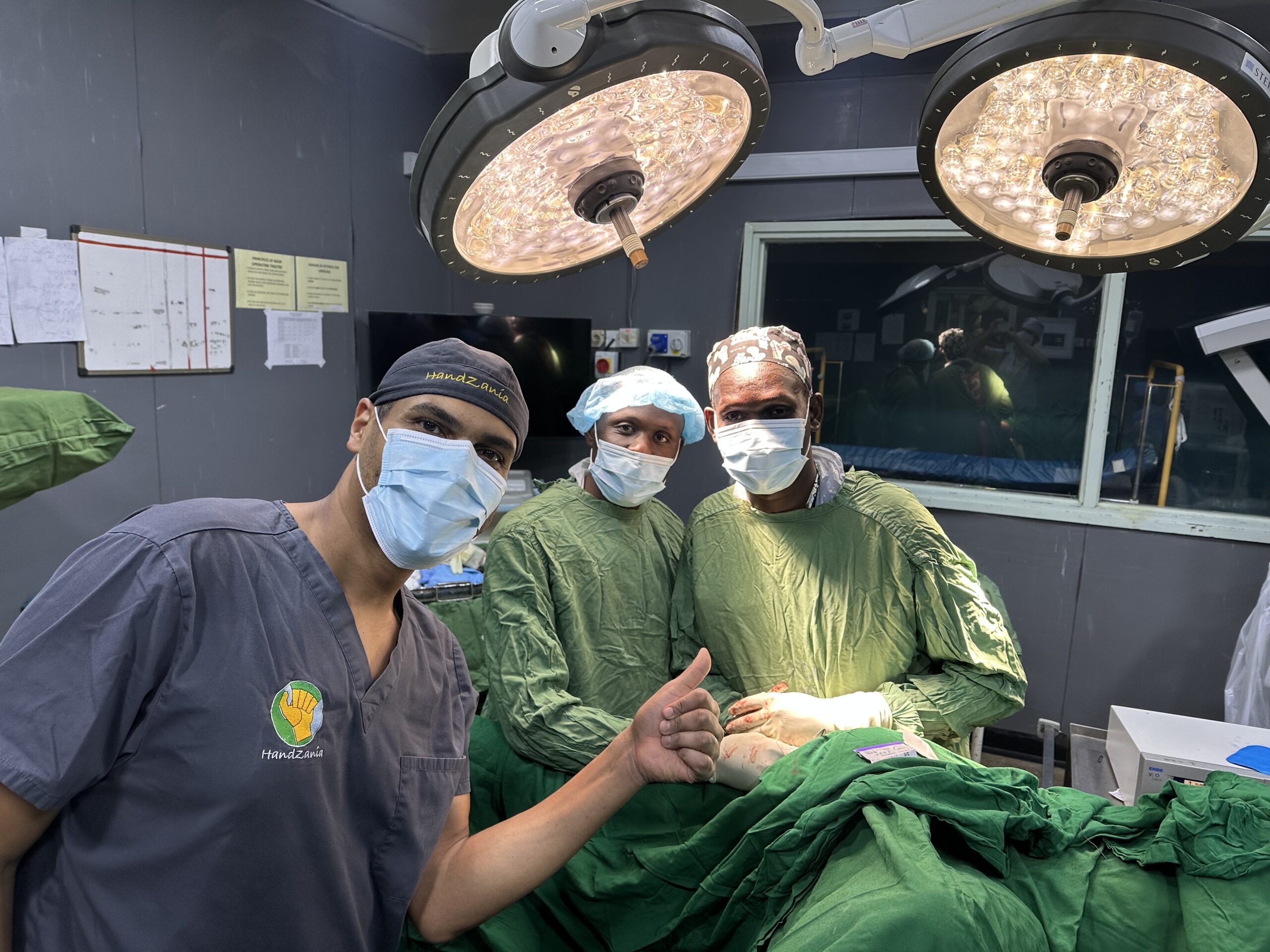 Handzania surgical team giving a thumbs up in the operating room